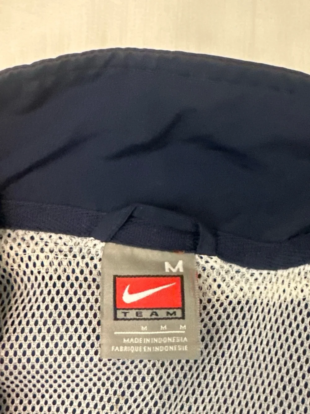 Vintage 1990’s Nike Men’s Navy Track Jacket with White Accents